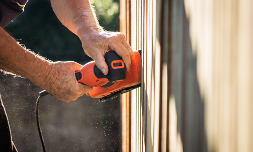 Sanding wood fence